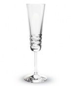 Classic technique, modern beauty. Crafted of fine Baccarat crystal, the Lola champagne flutes pair horizontal wedge cuts with a simply luminous base. The silhouettes of the toasting flutes in this collection radiate grace and sophistication.