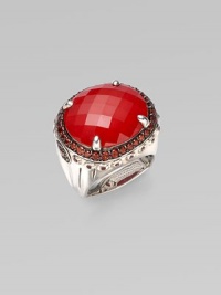 From the Batu Bamboo Collection. A substantial faceted oval of rich red coral sits in a bold bamboo-detailed sterling silver ring, edged by deeply colored pavé garnets. Red coral and garnet Sterling silver Width, about 1 Made in Bali