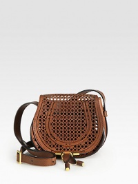 Perforated details freshen this compact silhouette with an adjustable crossbody strap. Adjustable crossbody strap, 19½-23½ drop Flap front closureOne open pocket under flapOne inside open pocketCotton lining7W X 7H X 4DImported