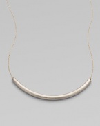 Eye-catching in its elegant simplicity, a gracefully curved, matte-finished silver bar appears to float on a delicate golden chain.SilverplatedGoldtoneLength, about 18Hook claspMade in USA