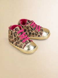 Baby takes a walk on the wild side in these eye-catching, metallic-accented canvas kicks with contrasting laces and leopard print design.Slip-onCanvas upperVelvet liningPolyurethane solePadded insoleImported