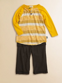 A cheery two-piece ensemble for your little guy, featuring a striped baseball-inspired shirt paired with soft pants. Ribbed crewneckLong sleevesButton frontContrast stitching at hemElastic waistbandFront pocketsBody: polyester/rayonTrim: modal/cottonMachine washImported