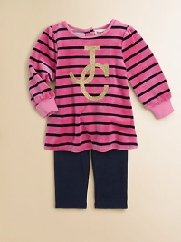 Crafted in plush velour, this stunning tunic features bold stripes and glimmering logo detail, paired with cozy leggings. Tunic Round necklineLong sleevesBack snaps Leggings Elastic waistbandCotton/Polyester/SpandexMachine washImported Please note: Number of snaps may vary depending on size ordered. 