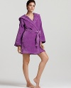 Plush, absorbent, and colorful women's robe with a hood and large bouclé croc on the shoulder.