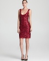 Shimmering sequins in a rich merlot hue lend a festive look to Aidan Mattox's simple scoop neck sheath.