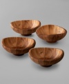 Individual salad bowls with elegant, swooping edges mimic the grace and beauty of a butterfly in flight. Crafted in rich acacia wood, this Nambé set makes a naturally striking backdrop for greens, mixed fruit and sides. Coordinates with salad bowl and servers.