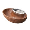 With its mood of counterpoint and connection, the Dharma Chip and Dip bowl adds a reflective beauty to the pleasures of snacking. Beautifully balanced, the piece combines a sensuous wooden bowl for chips or crudités with a gleaming inset alloy vessel for fresh salsa or aioli. The mix of materials is arresting yet harmonious, and the nesting oval silhouettes add to the design's flowing appeal. Intelligent craftsmanship makes the piece easy to use and clean, and its tilted axis creates beautiful presentation. An excellent gift for an entertainer, it coordinates seamlessly with Dharma bowls and trays or makes a stunning addition to an eclectic collection.