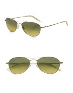 A revised look for the classic aviator style, designed with double-bridge detail and metal frames. Available in gold frames with gradient peridot lenses. 100% UV protective Imported 