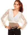 Bring feminine spirit to your outfit! Lacy sleeves balloon with soft drama on Planet Gold's ethereal crop top.