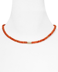 Basic yet bold. Let MICHAEL Michael Kors lend every look a colorful touch with this simple strand of coral beads, accented by a gold plated metal bar.