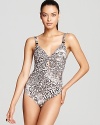 With a keyhole cutout and deep scoop back, Carmen Marc Valvo's snake print maillot is decidedly warm-blooded.