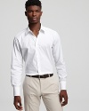 An ultraclean look. Cotton button-front shirt has spread collar, no pockets and a slightly lean fit.