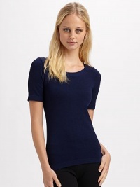 Sleek stretch knit with banded neckline and hem. Cotton/nylon/elastene Machine wash or dry clean Imported