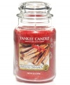 The gift that keeps on giving, this large Sparkling Cinnamon candle prolongs the season with a festive red hue and the smell of spicy cinnamon and cloves. A holiday classic from Yankee Candle.