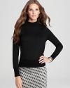 A hint of metallic lends subtle luster to a RAOUL sweater, finished with a chic mock neckline for understated elegance.