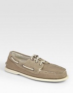 Classically constructed in stretchy canvas, this rugged staple has suede trim and signature laces. Rubber soleImported