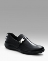 Soft calfskin with strap and logo buckle detail. Leather lining Padded insole Leather sole Made in Italy 