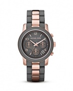 Grey is brightened with on-trend rose-gold tone in this sleek and contemporary timepiece from MICHAEL Michael Kors.