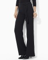 A modern wide-leg pant is crafted in fluid crepe with a heritage-inspired braided belt.