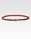 Rich skinny leather strip with goldtone hardware is the perfect waist-cinching accessory.About ½ wide Cow leather Imported 