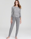 Baby it's cold outside. Warm up in PJ Salvage's striped thermal pajamas with a raglan-sleeve top and tapered-leg pants.