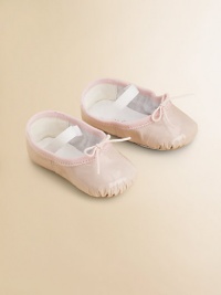 A stylish, shiny ballet flat for your tiny dancer with an elastic strap for a snug fit.Elastic strap with adjustable tiePatent leather upperLeather liningLeather solePadded insoleImported