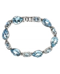 Refreshing hues for the season. Givenchy's gorgeous flex bracelet features pear-shaped aqua crystals and round-cut flecks of sapphire crystals. Set in imitation rhodium-plated mixed metal. Approximate length: 7-1/4 inches.