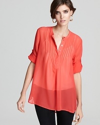 This season, a sheer French Connection top in ravishing red adds a jolt of hue for a bold new you.