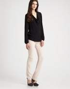 Long bishop sleeves accentuate this slightly slouched cowlneck. CowlneckLong bishop sleevesLong sleevesRibbed cuffsLonger length hits below the hipsRayonDry cleanImported of Italian fabric