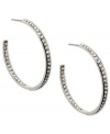 Cover every angle in sparkle. Givenchy's elegant hoop earrings flaunt an inside out design crystallized with Swarovski elements. Crafted in imitation rhodium plated mixed metal. Approximate diameter: 1-5/8 inches.