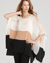 The flowing silhouette of this DKNY cold shoulder poncho blouse creates elegant movement in your wake. Dress is down for day and up for evening, the styling options are infinite.