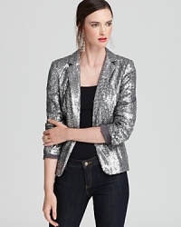 Draped in decadent sequins, this MICHAEL Michael Kors Petites blazer ignites your night with slim tailoring and statement shine. Slip it on and embrace the spotlight.