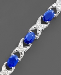 Oval-cut sapphires (8 ct. t.w.) and glittering round-cut diamonds (1/10 ct. t.w.) are a chic combination. Set in 14k white gold.