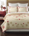 A smattering of fanciful florals and leaves sits upon a landscape of quilted beauty in this Cabin Flowers sham from Martha Stewart Collection. A touch of classic red offers a charming touch.