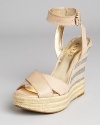 Nude leather, striped details and a raffia platform--we love the covetable details on GUESS's Kambria wedges.