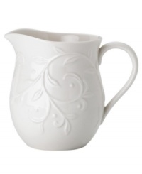 An elegant white-on-white pattern featuring an embossed vine motif and interior glaze lends the Opal Innocence Carved creamer to refined dining every day.