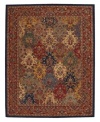 This rug features a floral motif in yarn-dyed blues, reds and golds for an intricate design of dramatic color. Handcrafted wool pile imparts an indulgent softness.