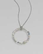 From the Confetti Collection. A wreath-shaped cable pendant, luxuriously set with pavé diamonds and other gemstones, dangles from a sterling silver chain. Diamonds, 0.05 tcw Blue topaz and iolite Sterling silver Chain length, about 16 Pendant diameter, about 1 Lobster clasp Made in USA