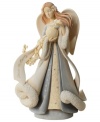 A gentle angel figurine brings joyous tidings to your home with her exquisitely crafted design and Peace on Earth inscription.