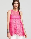 Work an ultra-feminine silhouette in this hotly hued Free People babydoll top, fashioned in delicate lace.