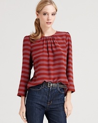 This silk Tegan top is striped to the nines and a match made in heaven with any of your denim favorites.