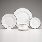 A sparkling complement to your silver serveware, this service mixes and matches perfectly with a wide color palette. Bone china.