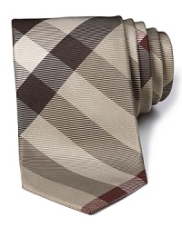 A signature check print tie from Burberry, handmade in England.