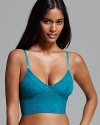 A hybrid of a lacy bra and cropped cami, this Free People bustier is perfect under both silky tanks and chunky knits. Style #F715F151.