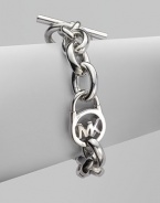 A sleek silvertone design with an iconic logo embellished lock on a chain link. Silvertone metalLength, about 8Toggle closureImported 