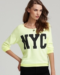 A rhinestone-bedecked NYC graphic shimmers on this highlighter-bright Vintage Havana sweatshirt.