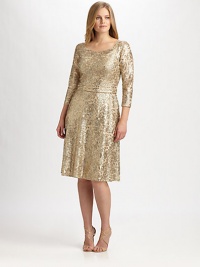 Shimmer and shine, a stunning style featuring a gorgeous metallic lace and allover sequins. Round neckThree-quarter sleevesAllover beadingConcealed back zipperFully linedAbout 23 from natural waist70% polyester/30% metallic threadDry cleanMade in USA of imported fabric