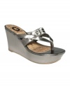 Make them look in G by Guess' Preview platform wedge sandals. A shiny upper sets the foundation for the sparkly logo on the straps.