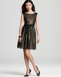 Metallic mesh shines on this Mark + James by Badgley Mischka dress, lending festive flair to the evening's events.