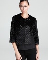 Exotics go elegant as sequin embellishment illuminates a textured DKNY faux-fur jacket. Whether worn with cocktail dresses or distressed denim, the luxe piece layers on for instant glamour.